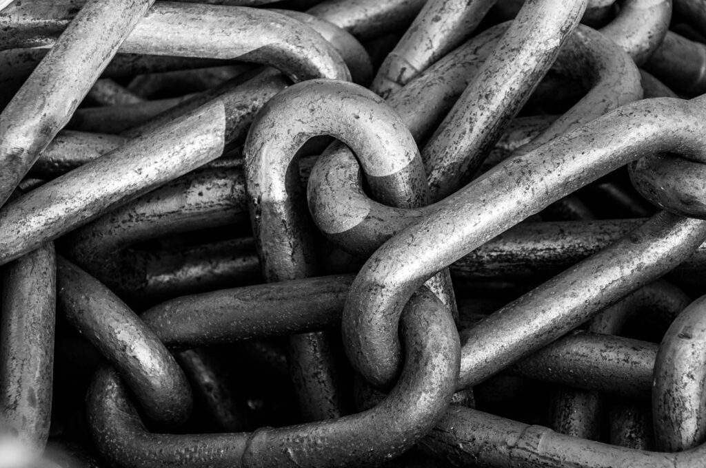 Close-up of connected metal chain links representing link building and backlinks