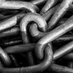 Close-up of connected metal chain links representing link building and backlinks