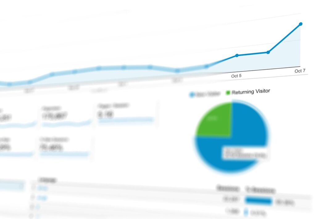 GA4 dashboard with traffic and engagement charts on a laptop