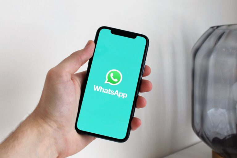 Indian shop owner using WhatsApp on a smartphone for WhatsApp marketing