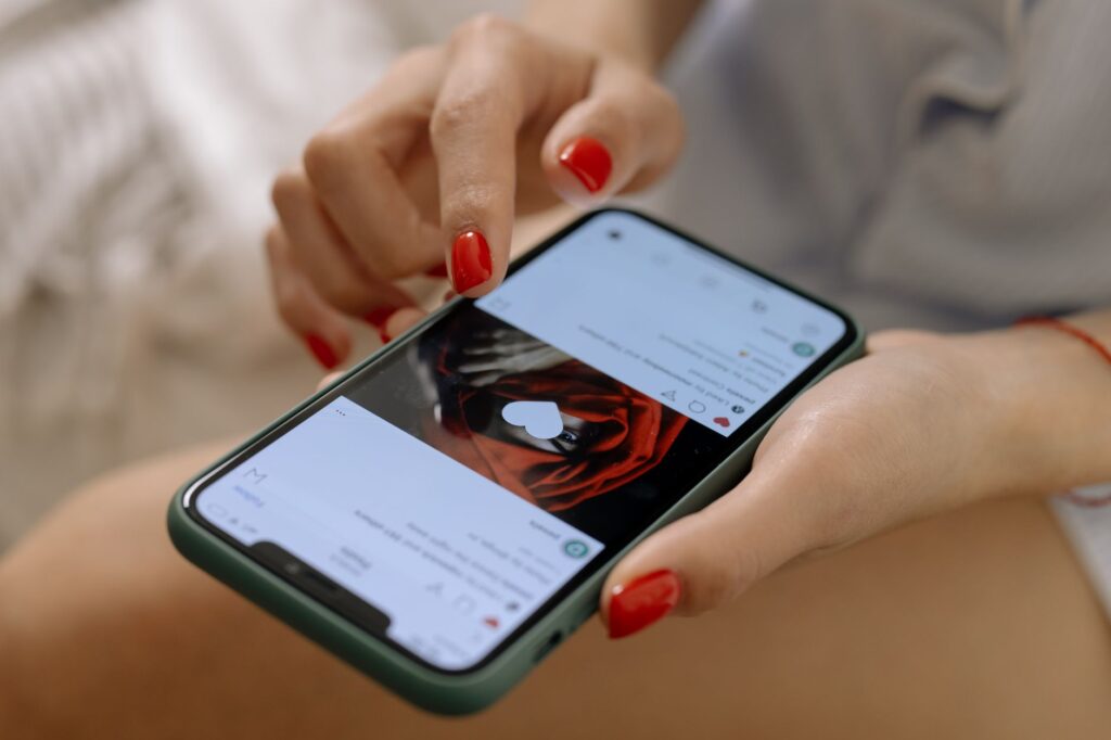 Indian shopper browsing social media on a smartphone