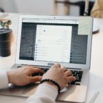 Laptop on a desk showing an email inbox, illustrating email deliverability myths and checks