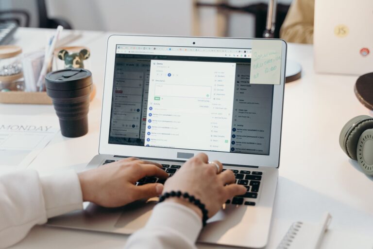 Laptop on a desk showing an email inbox, illustrating email deliverability myths and checks