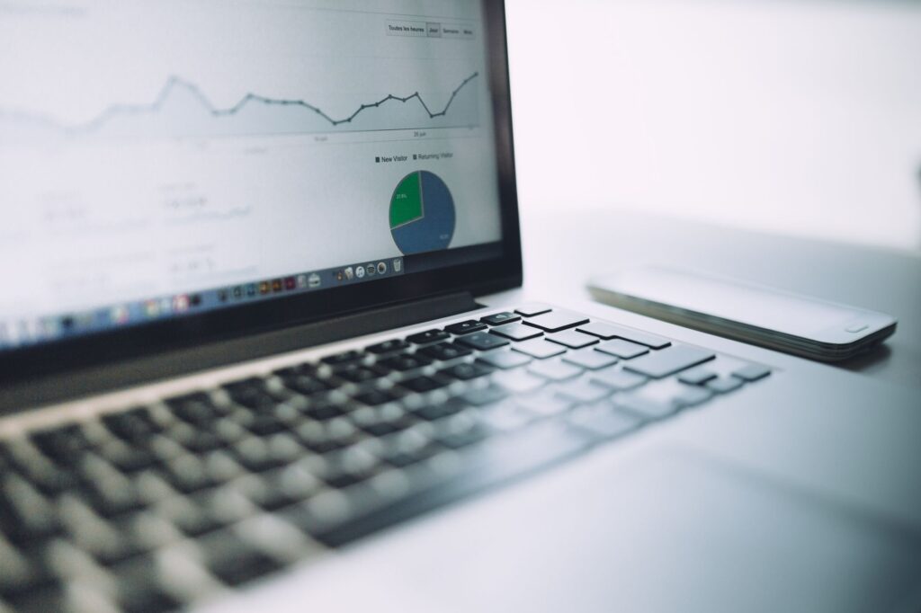 Laptop on a desk showing website analytics charts, illustrating Google Search Console features for SEO reporting