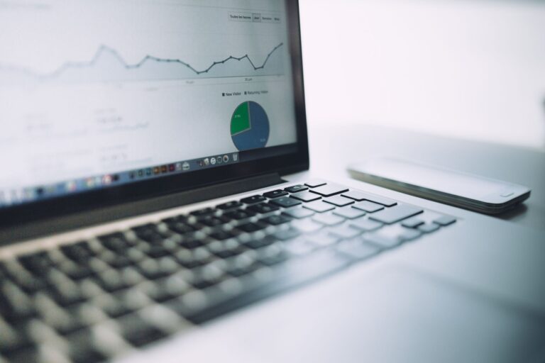 Laptop on a desk showing website analytics charts, illustrating Google Search Console features for SEO reporting