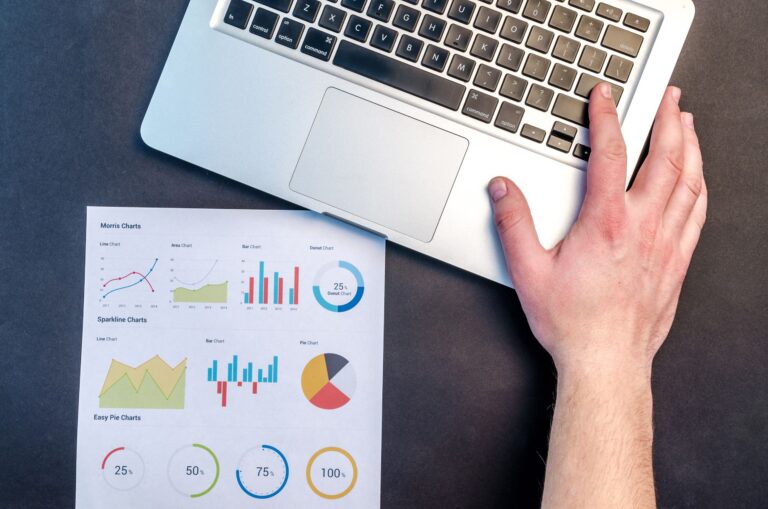 Laptop showing website analytics charts, illustrating Microsoft Clarity AI Visibility tracking of AI bots and AI traffic
