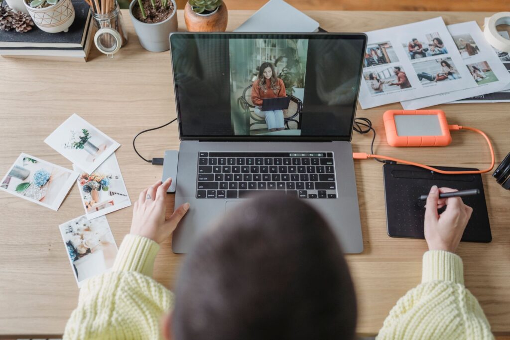 Marketer reviewing ad copy on a laptop before ChatGPT Ads creative enhancements go live