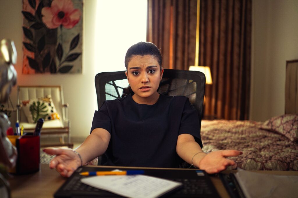 Marketer reviewing ChatGPT usage data on a laptop