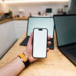 Marketer reviewing Meta ads updates for Facebook and Instagram campaigns on a laptop