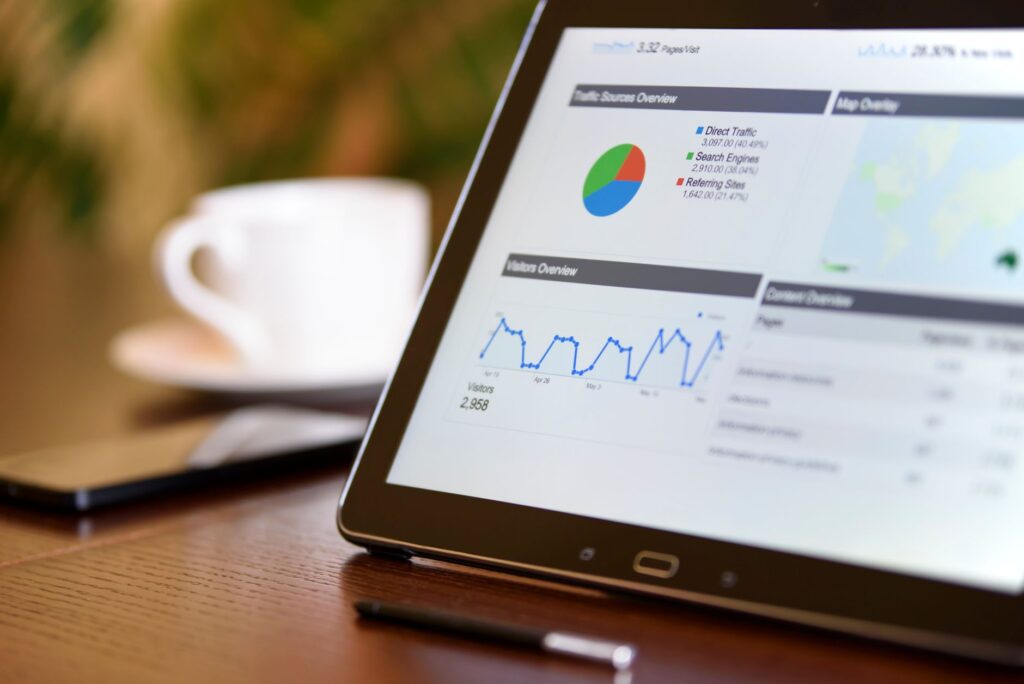 Marketer reviewing Microsoft Clarity AI Visibility data on a laptop