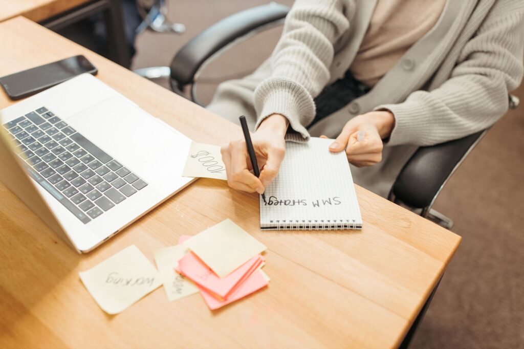 Marketer using Gemini Notebook for marketers to organise research sources on a laptop