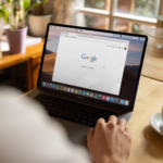 Marketer working on SEO for a website on a laptop