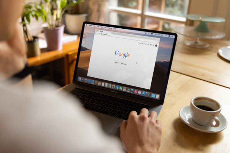 Marketer working on SEO for a website on a laptop