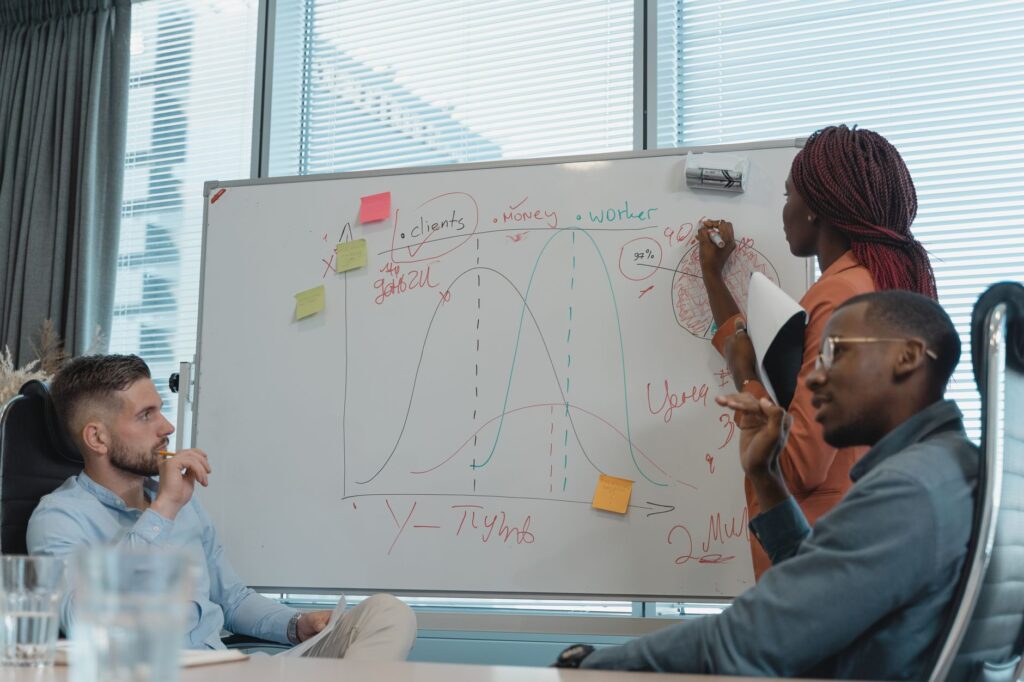 Marketing team planning a 90-day SEO roadmap on a whiteboard