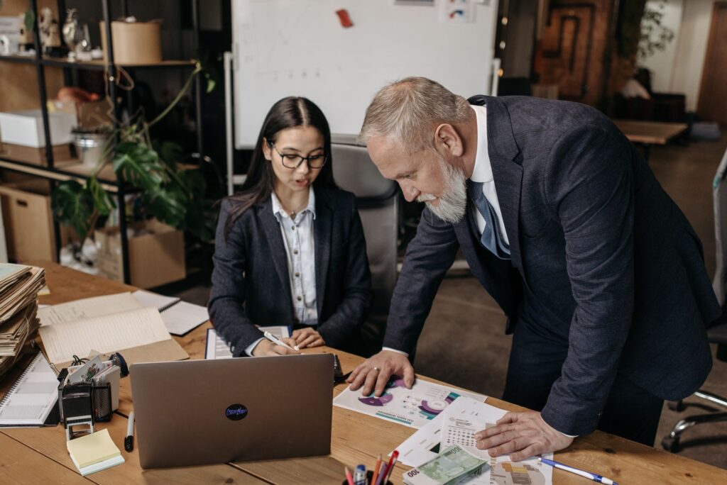 Marketing team reviewing email list and consent data on a laptop