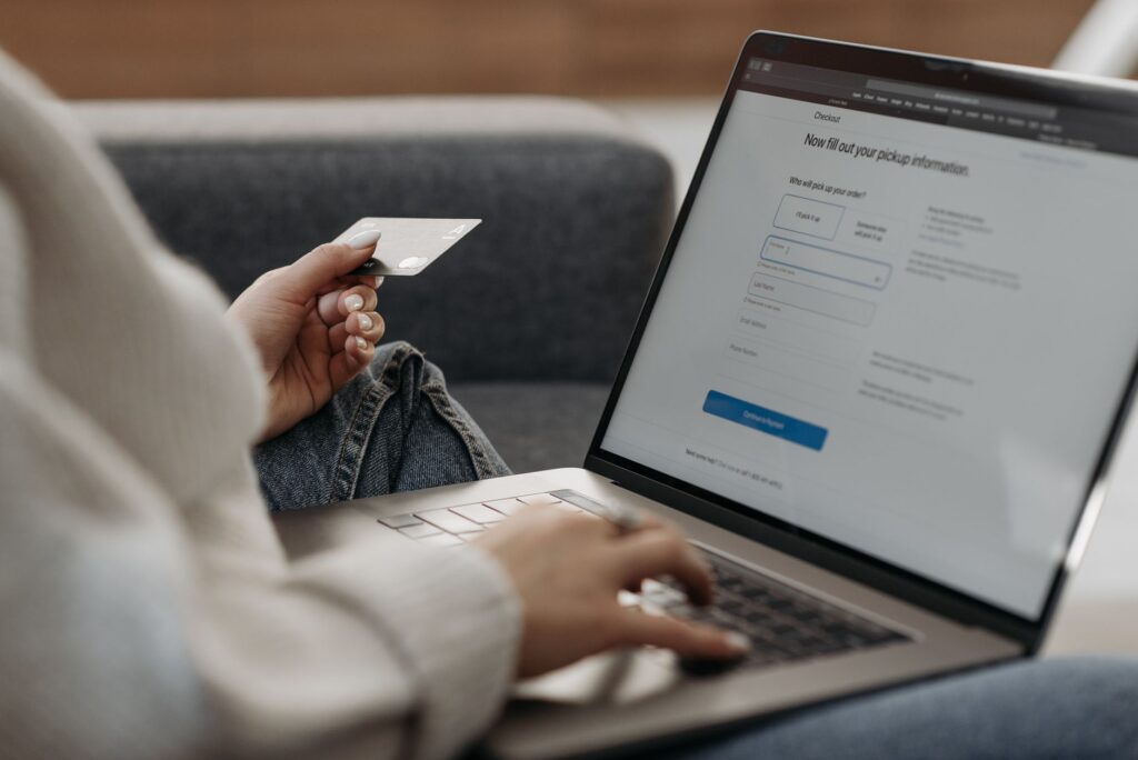 Online shopping checkout on a laptop showing a new customer order for Google Ads customer lifecycle goals