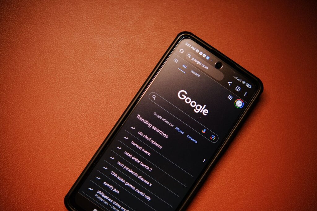 Person checking AI Overviews on commercial keywords on a smartphone