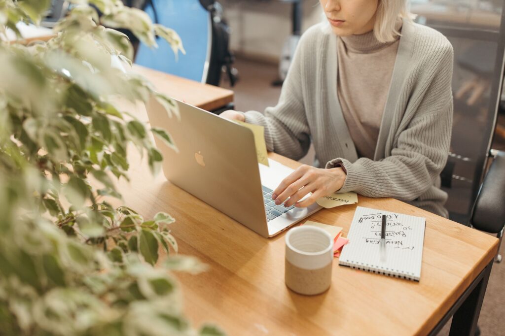 Person checking email on a laptop, the kind of data Google AI Mode ads can now draw inferences from