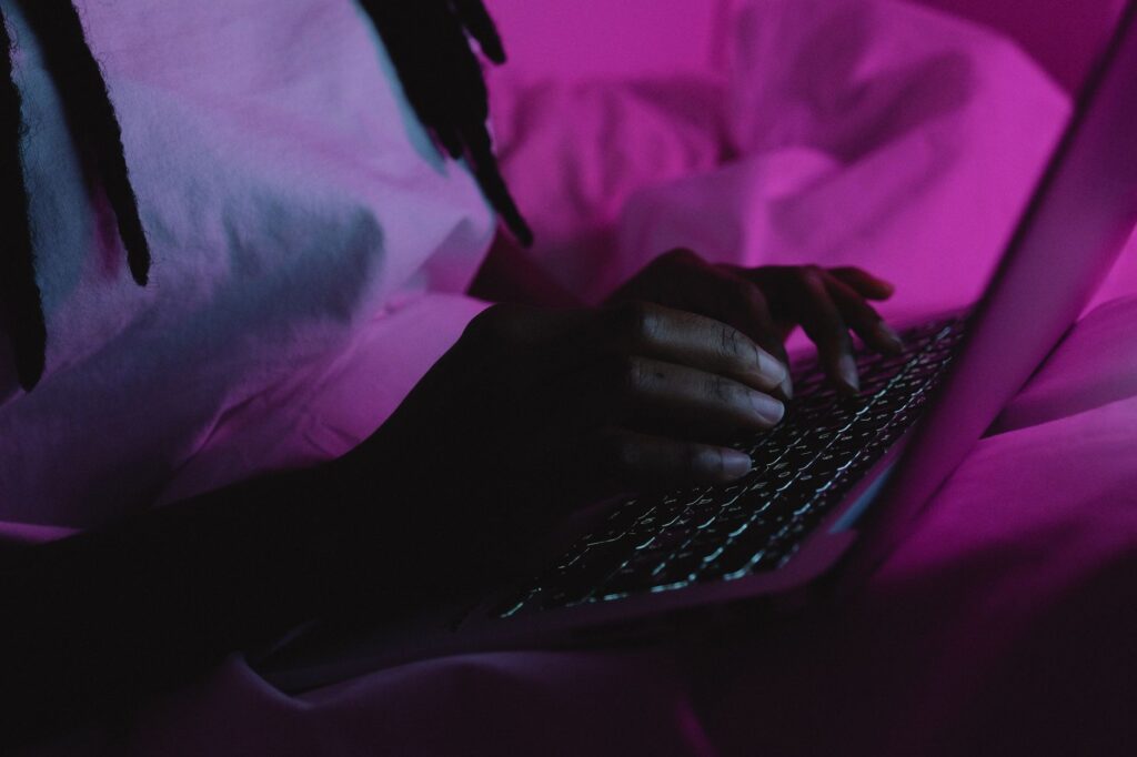 Person typing a question into an AI chat on a laptop, illustrating ChatGPT usage data