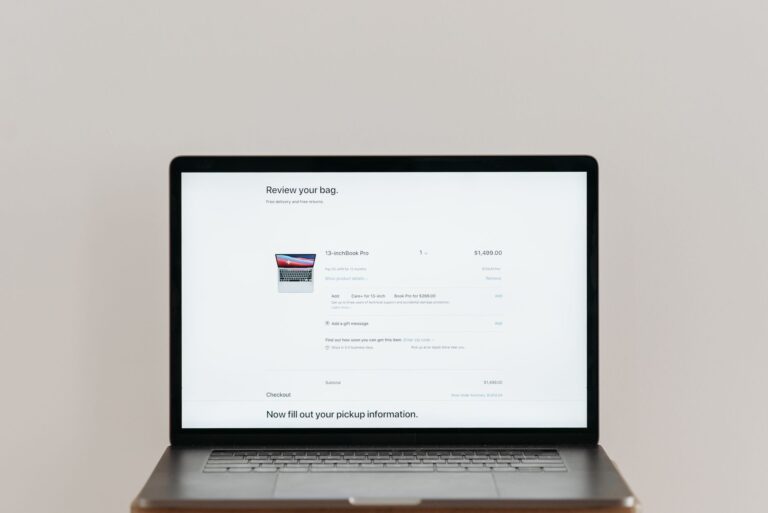 Shopper checking out on a laptop, illustrating Google Ads customer lifecycle goals for new customer acquisition