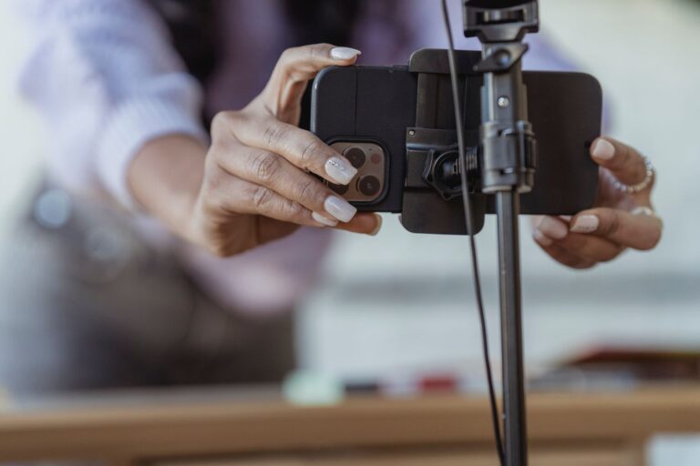 Smartphone on a tripod recording vertical video for YouTube Shorts original content