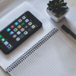 Smartphone with social media apps on a desk, representing social media marketing strategy for Indian brands