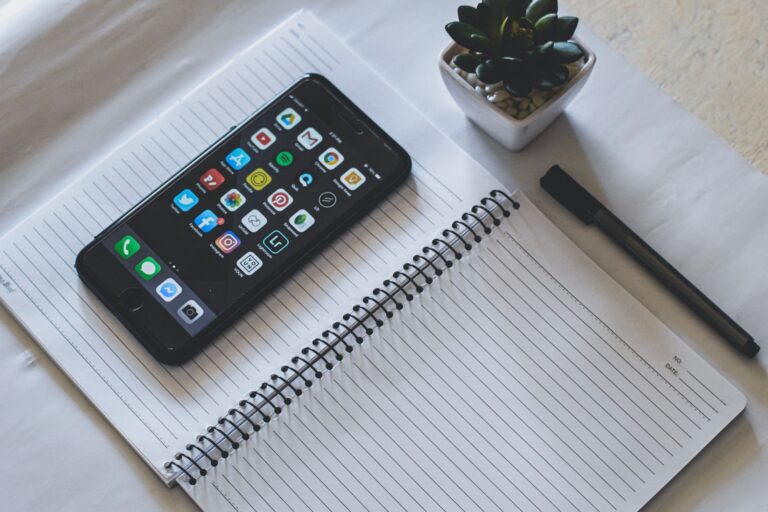 Smartphone with social media apps on a desk, representing social media marketing strategy for Indian brands