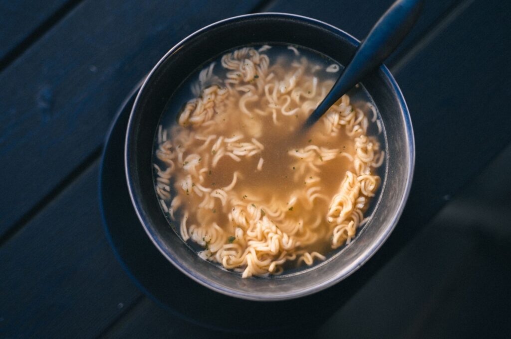 Steaming bowl of instant noodles by a rain-streaked window, a mood occasion from the Maggi case study